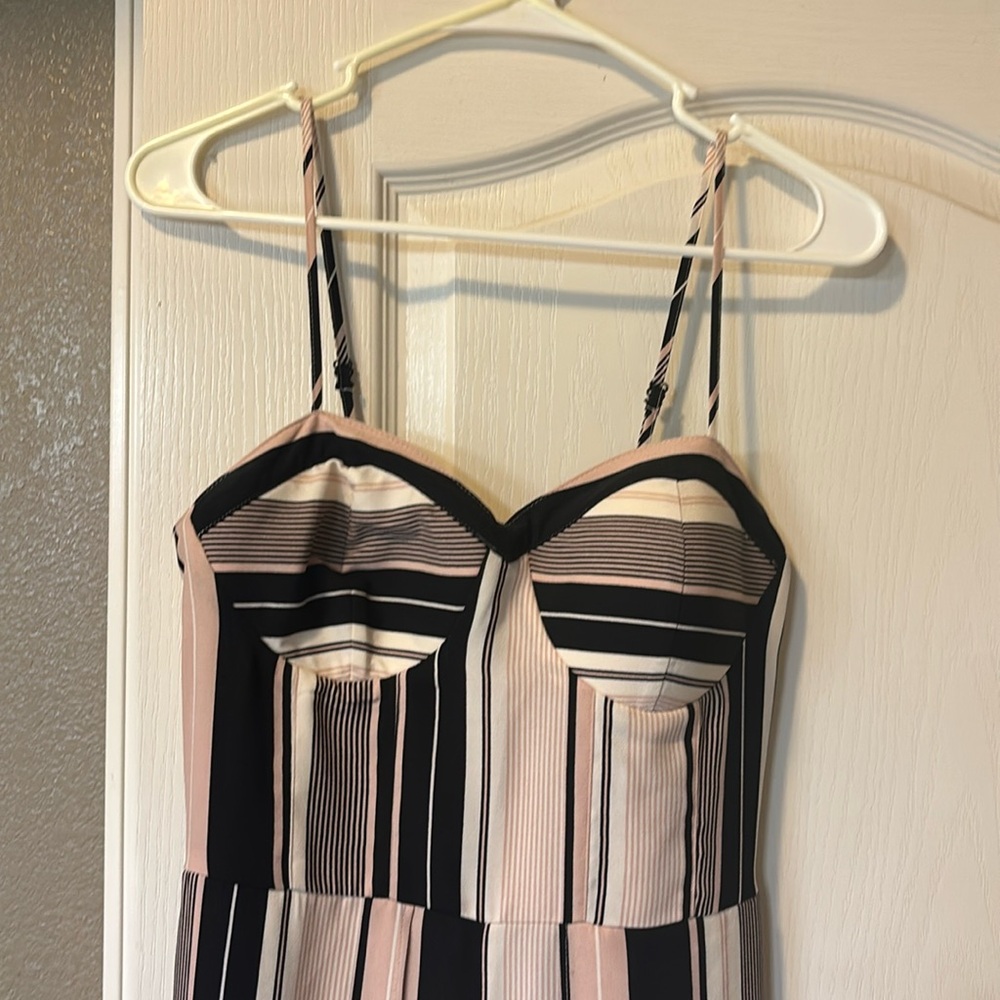 Flowy pant romper. Has slits in the legs for flowy dress look.